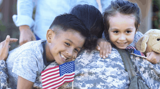 two-kids-hugging-military