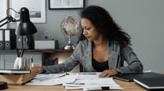 lady-sitting-desk-papers